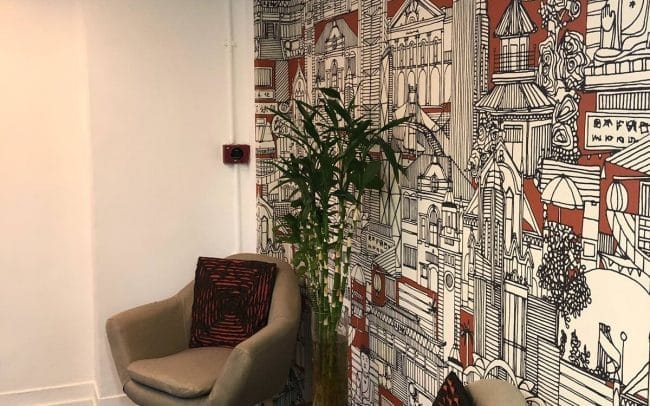 HK Works Hong Kong themed feature wall at the entrance of the offices